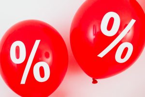2 Red Balloons with percentages on them to go with the article talking about comparison rates